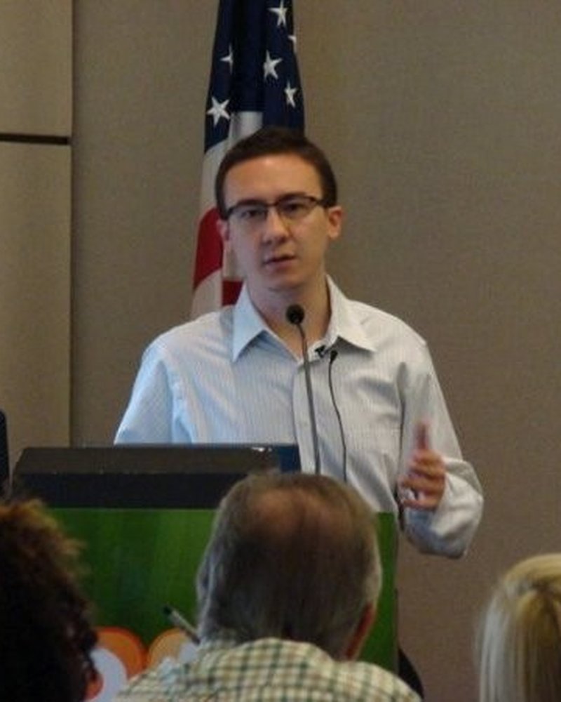 Eric Barker, founder of Design Delulu, speaking at a conference